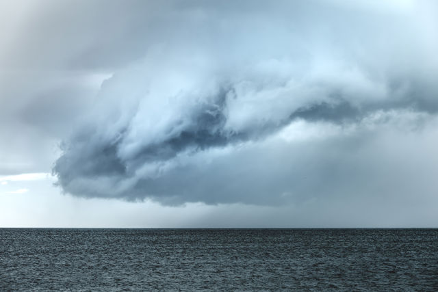 Cloud One - A rain cloud passing over the ocean