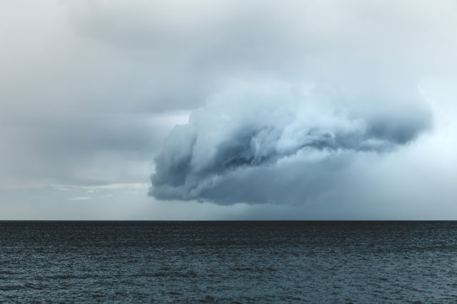 Cloud II - A rain cloud passing over the ocean