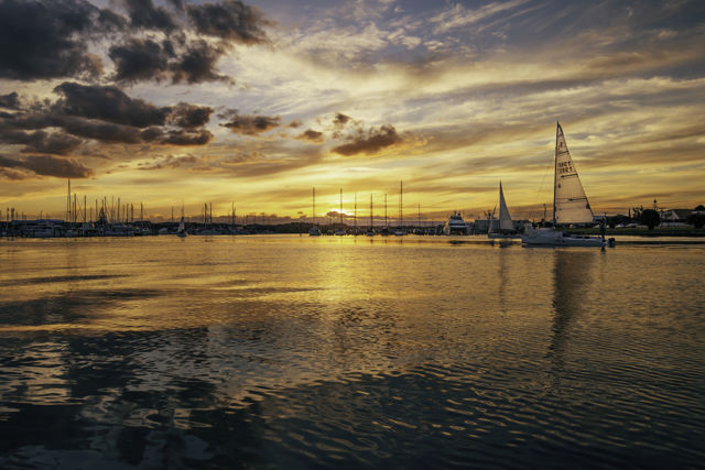 Home By Sunset - Yachts coming into Ahuriri marina at sunset