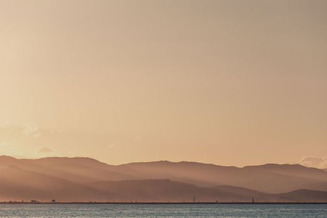 Espresso Love - A sunset view across Ahuriri harbour to the beacons and hills behind Hawke's Bay airport