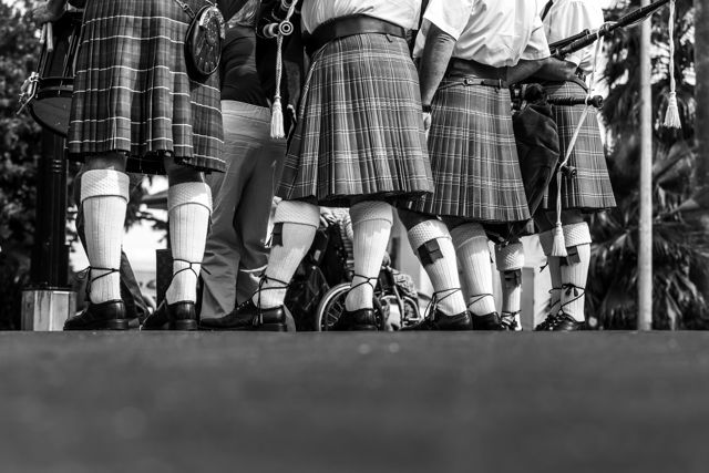 Kilts 2 - Scottish band warming up for a parade