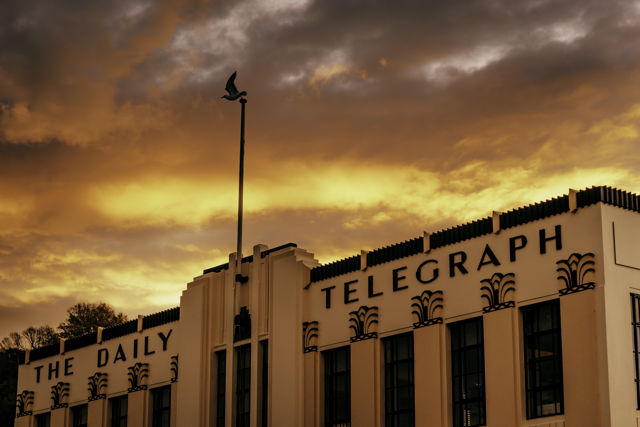 The Daily Telegraph - A fiery sunset (and departing seagull) over the beautiful Art Deco Daily Telegraph building in Napier, Hawke's Bay.