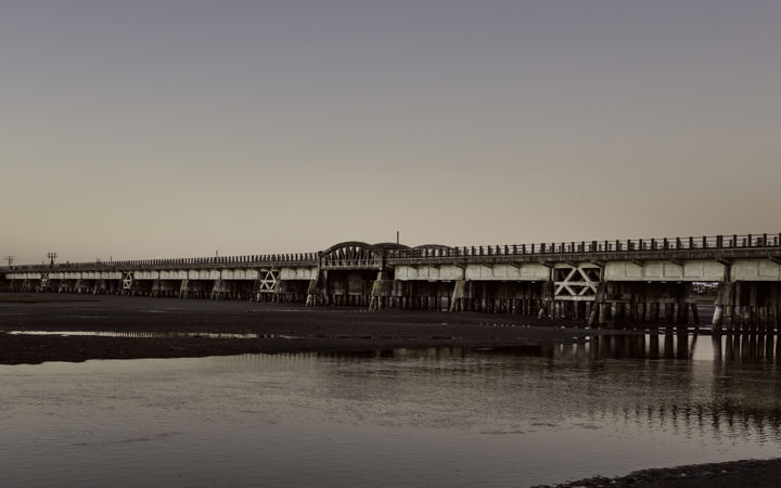 Ahuriri Estuary Bridge - The old embankment bridge over Ahuriri Estuary at low tide