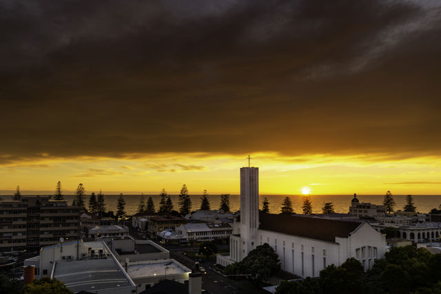 Napier City Sunrise - A super colourful, dramatic sunrise over Napier with the Anglican Cathedral in the foreground.