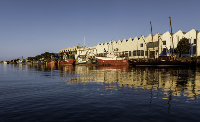 Ahuriri Fishing Boats & Woolstores - Sunny blue skies and calm water in Ahuriri harbour.