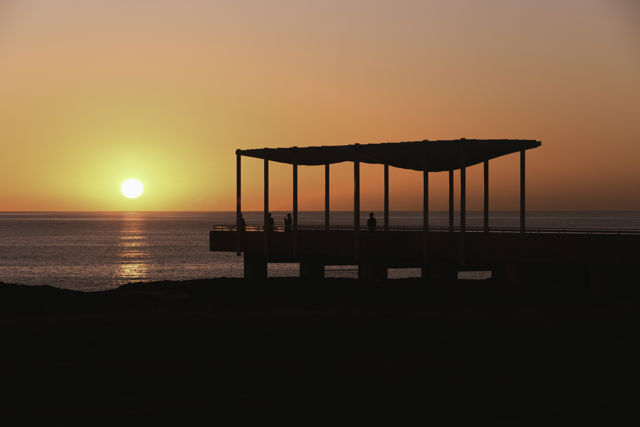 Morning Sunshine - Sunrise over the Pacific Ocean silhouetting Napier's Ocean Viewing Platform