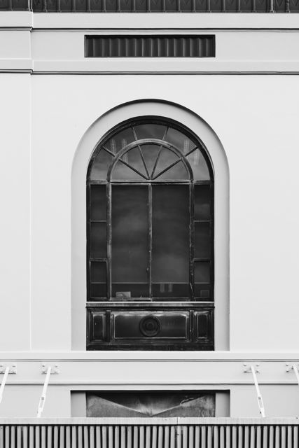 Arch Decided - Arch window on a Spanish Mission style building in Napier