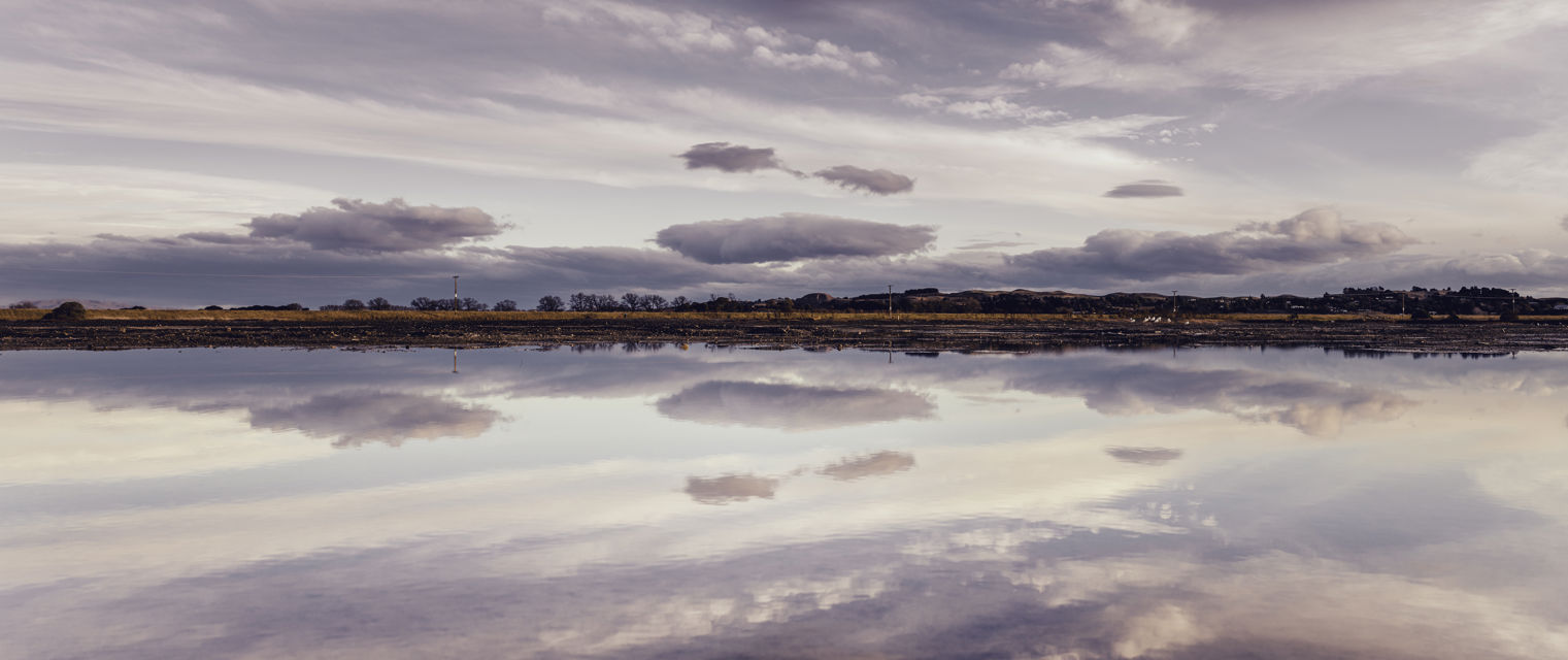 Estuary Reflections - Still water and mirrored clouds over Pandora Estuary
