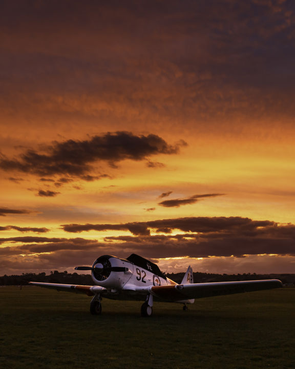 Tomorrow We Fly 92 - Vibrant sunset over a classic Harvard aircraft at Hawke's Bay Airport